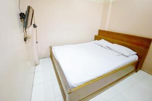 Lova arba lovos apgyvendinimo įstaigoje Tangki Premier Residence RedPartner