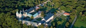 an aerial view of a large castle in the forest at Kloster Huysburg Ekkehard Haus in Dingelstedt