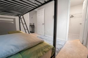 a bedroom with a bed with a metal bed frame at Charming Home near Seaworld in Helotes