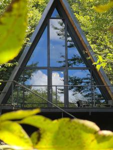 a view of a building with a glass window at Cottage Sataplia in Kutaisi