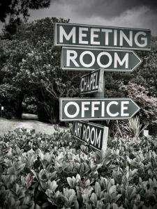 a sign for a meeting room and a small office sidx sidx sidx sidx at The Volmoed Trust in Hermanus