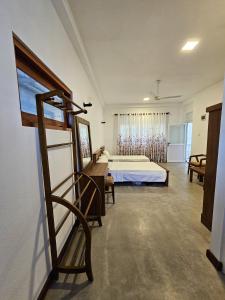 a bedroom with a bed in a room at The Hostel in Gampaha