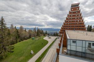 a view from the balcony of a building at Hotel Toliar in Štrbské Pleso