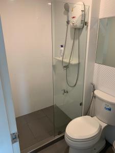 a bathroom with a shower and a toilet at 2 mins walk to BTS Bang Chak in Bangkok