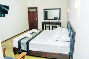 Ένα ή περισσότερα κρεβάτια σε δωμάτιο στο ShiCo Transit Hotel