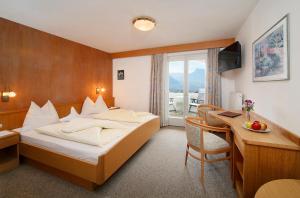 Postel nebo postele na pokoji v ubytování Garni-Hotel Tritscherhof + 27 fotografií