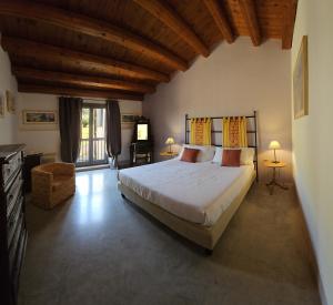 a bedroom with a large bed in a room at Relais Casa Mirabile in Menfi +76 photos