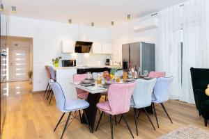 a kitchen and dining room with a table and chairs at Villa Luna & Pia for families in Pula for 10 people with heated pool - pet friendly in Pula