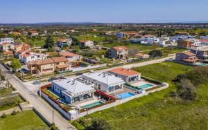an aerial view of a small town with houses at Villa Luna & Pia for families in Pula for 10 people with heated pool - pet friendly in Pula