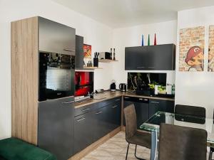 A kitchen or kitchenette at Apartman Olive