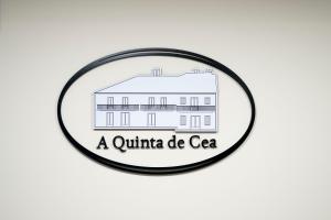 a quinilla de cece logo with a white building at A Quinta de Cea in Cea
