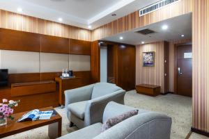 TV a/nebo společenská místnost v ubytování Regardal Hotel