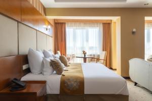 Postel nebo postele na pokoji v ubytování Regardal Hotel
