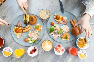 a table with three plates of food on it at The Royal Park Canvas - Kobe Sannomiya in Kobe