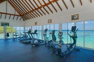 a gym with rows of treadmills and exercise bikes at OBLU NATURE Helengeli-All-Inclusive with free Transfers in North Male Atoll