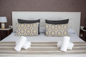 A bed or beds in a room at Hotel Matilde by Grupo Matilde