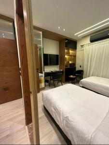 Postel nebo postele na pokoji v ubytování Elite Boutique Hotel