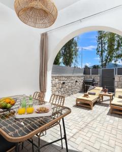 a patio with a table with fruit on it at Kimia Luxury Apartments in Kolimbia