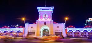 a building with a clock tower at night at THU's APARTMENT near Ben Thanh Market in Ho Chi Minh City