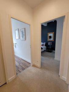 an empty hallway with a room with a bed in it at Pavillon des Millésimes in Lussac