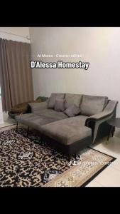 a living room with a couch and a rug at D'Alessa Homestay in Alor Setar