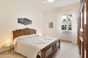Postel nebo postele na pokoji v ubytování Giuly House, Terre Marine