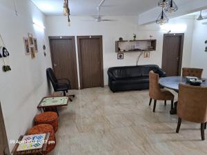 a living room with a couch and a table at City Central Hostel in Kolkata