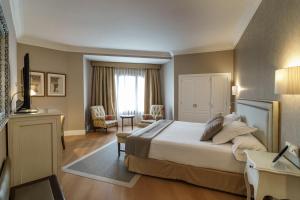 Postel nebo postele na pokoji v ubytování Hotel Carlton + 37 fotografií