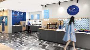 a rendering of a coffee shop with people walking through the counter at Holiday Inn Express Suzhou Dushu Lake, an IHG Hotel in Suzhou