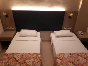 Postel nebo postele na pokoji v ubytování Hamle Hotel