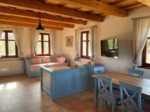 a living room with a couch and a table at Chata GOLDENBACH in Malá Morava