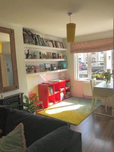 a living room with a couch and a table at Spacious 3 bed townhouse in Dublin 12 in Dublin