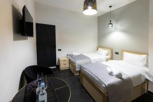 Voodi või voodid majutusasutuse EVN Rooms toas