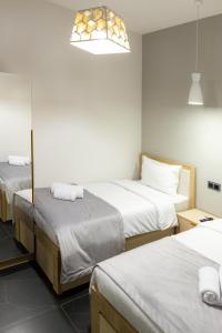 Voodi või voodid majutusasutuse EVN Rooms toas