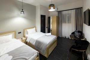 Postel nebo postele na pokoji v ubytování EVN Rooms