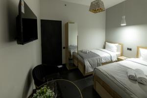 Voodi või voodid majutusasutuse EVN Rooms toas