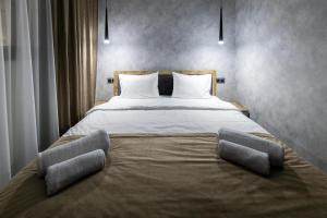 Voodi või voodid majutusasutuse EVN Rooms toas