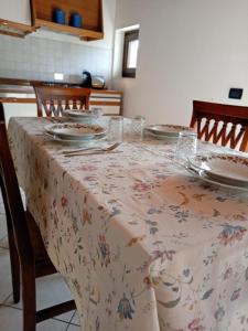 a table with a flowered table cloth on it at La Colombara in Fara Vicentino