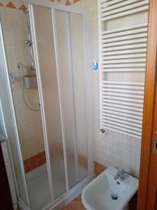 a bathroom with a shower and a sink at La Colombara in Fara Vicentino