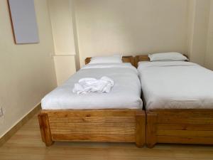 Katil atau katil-katil dalam bilik di Beli Guest House
