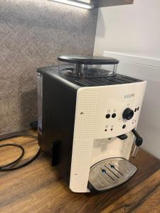 a microwave oven sitting next to a toaster at Penzion U Křížku in Malá Morávka