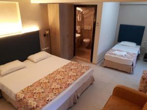 Postel nebo postele na pokoji v ubytování Hamle Hotel