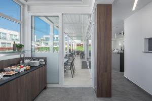 a dining room with a view of a dining table at Maj Luxury Residence in Poreč