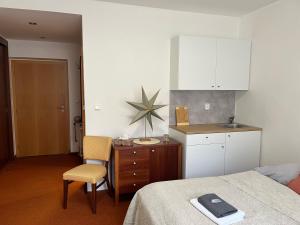 Kuchyň nebo kuchyňský kout v ubytování Simply rooms