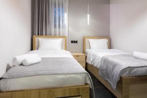 Voodi või voodid majutusasutuse EVN Rooms toas
