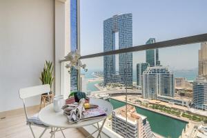 a balcony with a table and a view of the city at Frank Porter - Studio One in Dubai