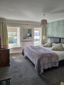 Voodi või voodid majutusasutuse Roundstone House Hotel toas