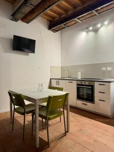 a kitchen with a table and chairs in a room at Casa Viaggi in Castel Guelfo di Bologna