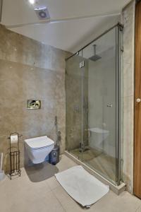 a bathroom with a glass shower and a toilet at Sea View & Hassan 2 Mosque By TheCasaEdition (B18) in Casablanca