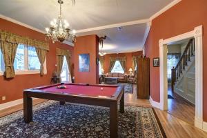 a living room with a pool table in it at Governor's Mansion beautiful 3bd with pool table in Leadville